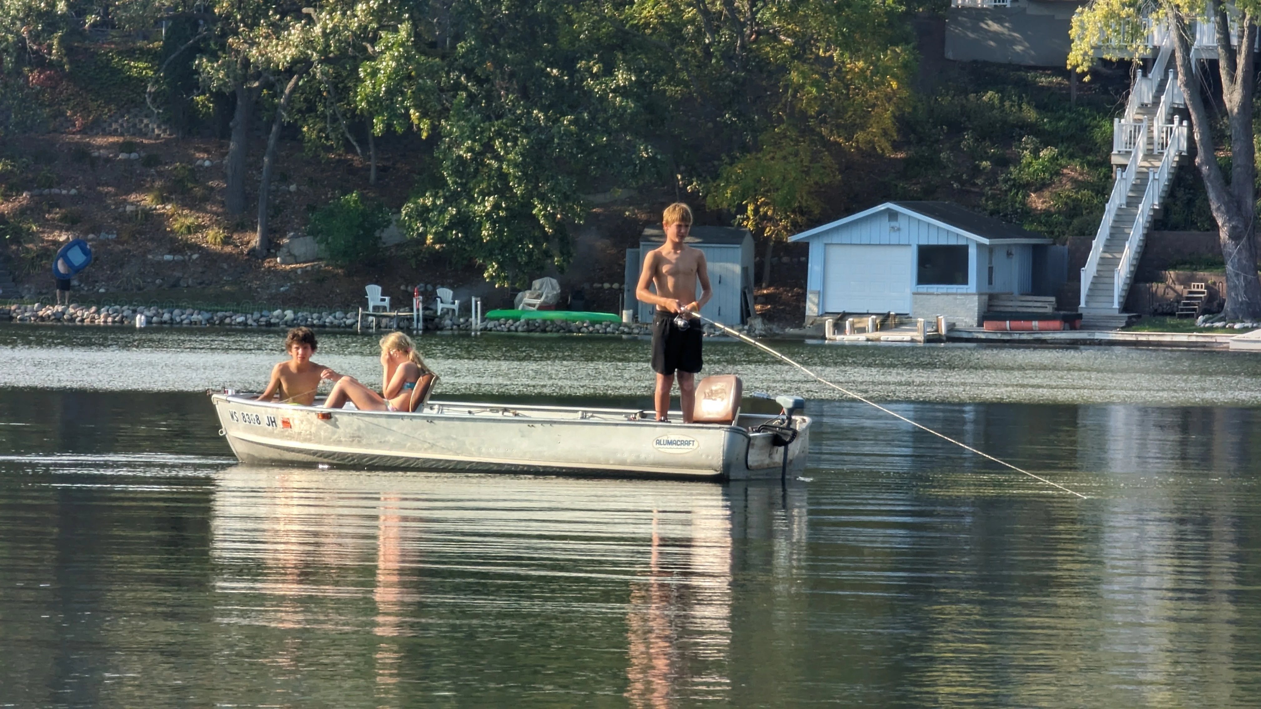 Family fishing from a small boat