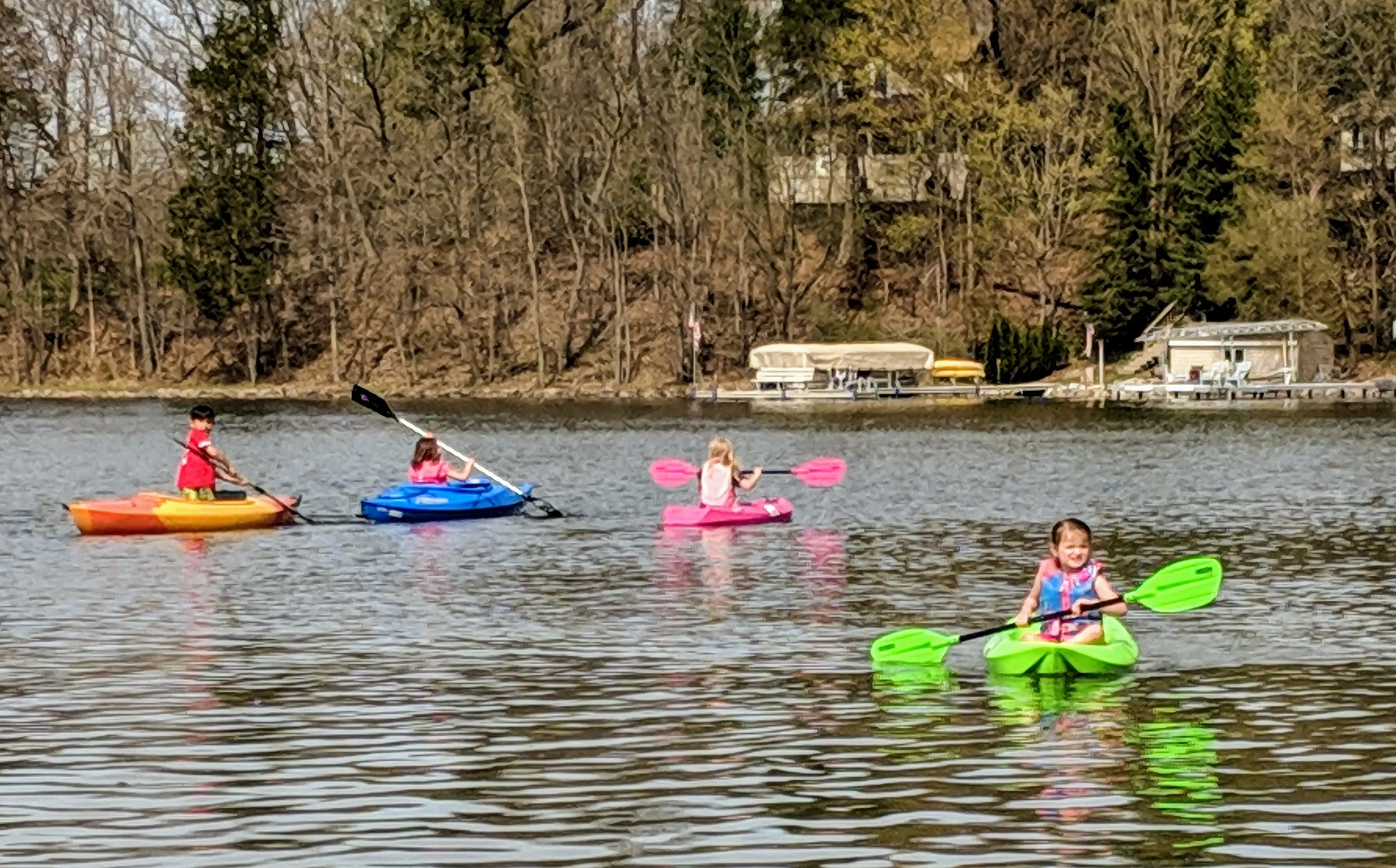 Group kayaking on the lake