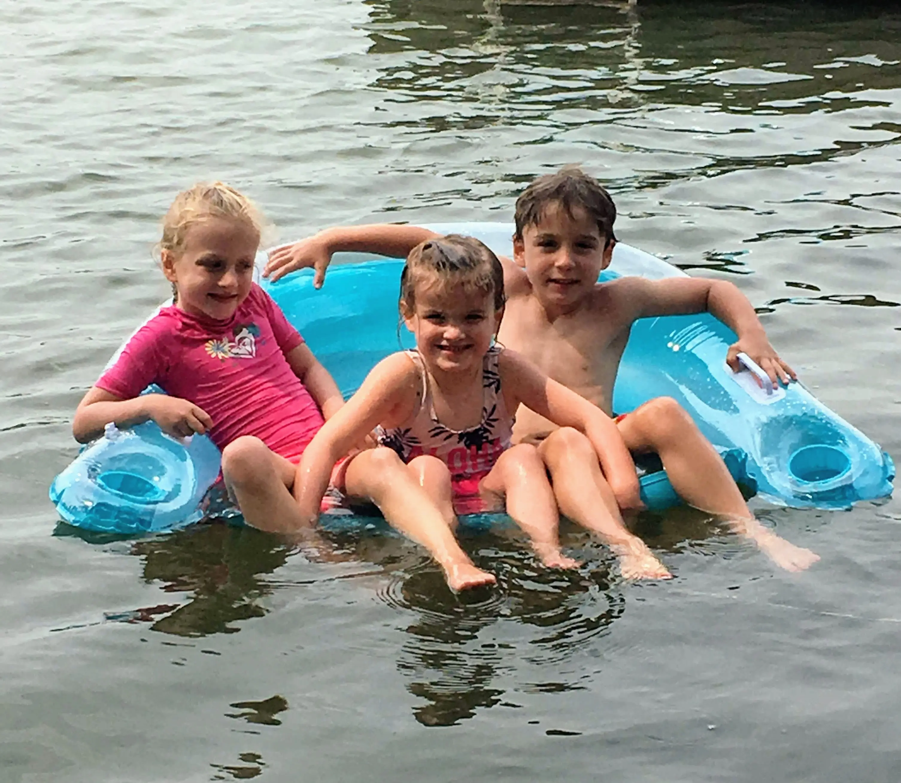 Kids swimming together on Lake Keesus