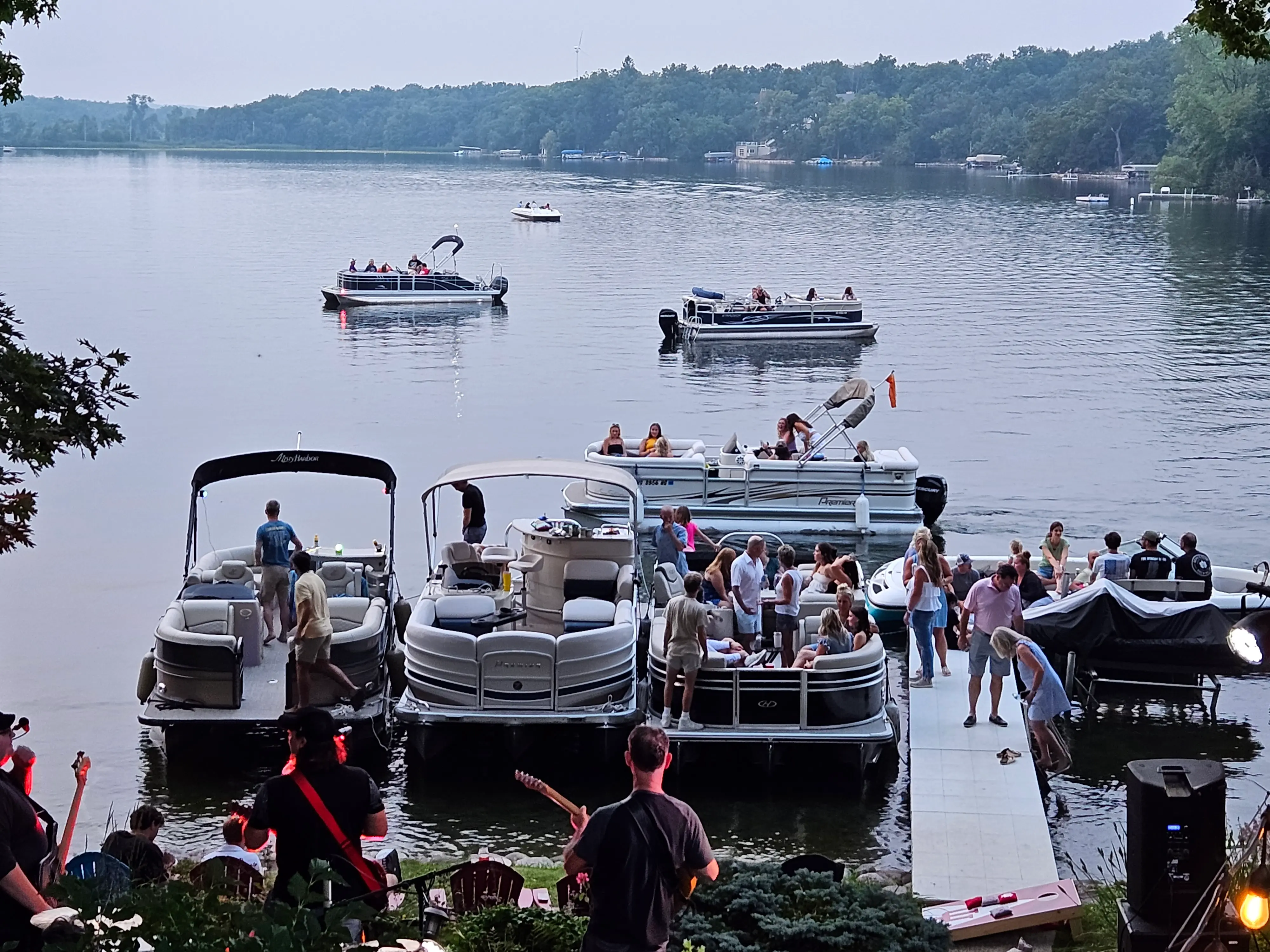 Pontoon boats gathered on the lake