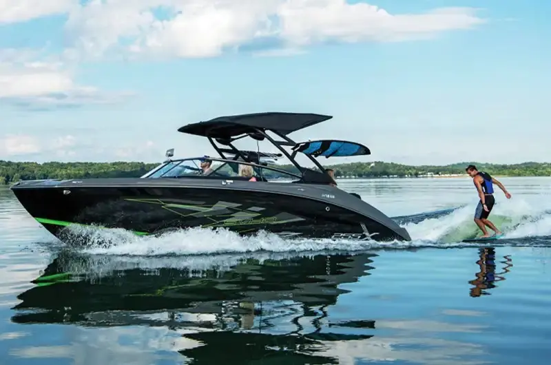 Wake surfer behind a boat